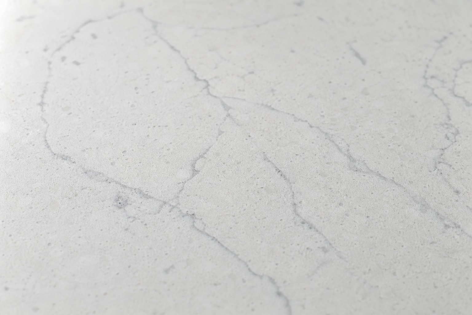 Stone quartz counter beside a built-in Sub-Zero protected during a Cupertino repair visit